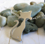 Cta pendant necklace with whiskers and long curly tail handmade in sterling silver