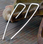 Square wire line silver earrings on gray stone