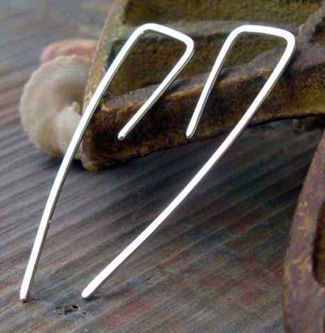 Square wire line silver earrings on gray stone