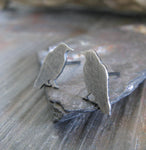 Raven bird earrings on gray stone