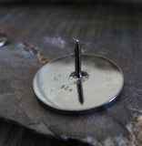 back of oxidized silver round tie tack