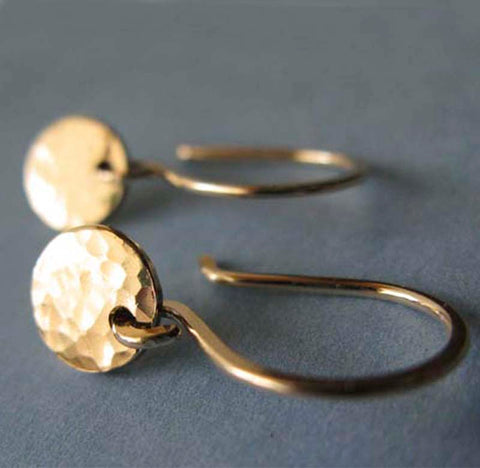 Little gold earrings with hammered disc gray background