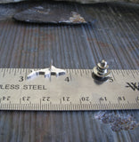 Shark tie tack pin shown on ruler
