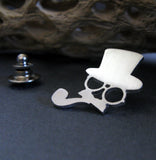 Lapel pin with man in top hat glasses and pipe on black