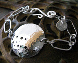 Sterling Silver handcrafted disc bracelet. Unique statement jewelry. Sam