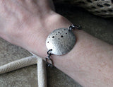 Sterling Silver handcrafted disc bracelet. Unique statement jewelry. Sam