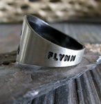 Sterling Silver Ring with Engraved Pet Name on Stone Gray Background with Branch