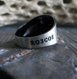 Sterling Silver Ring with Engraved Pet Name on Stone Gray Background with Branch