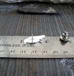 sitting raven tie tack shown on ruler