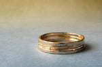 Trio of gold thin stacking rings