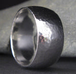 Sterling silver wide hammered ring band close up