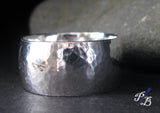 hammered silver wide band ring close up