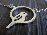 Bird in ring perch dainty sterling silver necklace. Handmade in the USA.