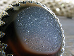 Close up of chocolate agate druzy gemstone