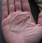 Silver wire spike earrings in hand
