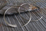 silver hoops on gray stone
